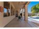 Covered patio provides shade and a view of the backyard pool, perfect for outdoor relaxation at 4614 W Fallen Leaf Ln, Glendale, AZ 85310