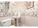 Vintage-inspired powder room with floral wallpaper and pedestal sink at 4614 W Fallen Leaf Ln, Glendale, AZ 85310