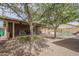 This home features a serene backyard with synthetic grass, pool, and a covered patio for relaxation and enjoyment at 4653 E Encanto St, Mesa, AZ 85205