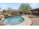 A private backyard pool with rock waterfall feature offers a serene escape and enhances outdoor living at 4653 E Encanto St, Mesa, AZ 85205