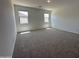 Spacious bedroom with plush carpeting and natural light, creating a cozy and inviting retreat at 47251 W Mellen Ln, Maricopa, AZ 85139