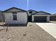 Charming single-Gathering home featuring a two-car garage and a low maintenance desert landscape at 47251 W Mellen Ln, Maricopa, AZ 85139