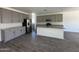 This kitchen features stainless steel appliances, granite countertops, and tile flooring at 47251 W Mellen Ln, Maricopa, AZ 85139