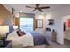 Serene bedroom with a comfortable bed, large window, and modern decor, creating a peaceful retreat at 4924 W Capistrano Ave, Laveen, AZ 85339