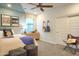 Stylish bedroom with a cozy bed, decorative pillows, and musical accents, offering a personalized space at 4924 W Capistrano Ave, Laveen, AZ 85339
