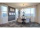 Dining room featuring contemporary decor, large windows, and ample natural light at 4924 W Capistrano Ave, Laveen, AZ 85339