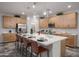 Well-equipped kitchen with stainless steel appliances, generous cabinet space, and a large island at 4924 W Capistrano Ave, Laveen, AZ 85339