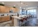 Bright kitchen with light wood cabinets, white countertops, and a spacious island with seating at 4924 W Capistrano Ave, Laveen, AZ 85339