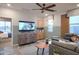 Cozy living room featuring stylish decor, comfortable seating, and a media center, perfect for relaxation at 4924 W Capistrano Ave, Laveen, AZ 85339