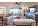 Bright, open living room featuring recessed lighting, ceiling fan, neutral paint, modern furnishings and sliding glass doors at 4924 W Capistrano Ave, Laveen, AZ 85339