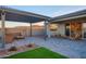 Spacious patio with a pergola, comfortable seating, and scenic mountain views, creating an ideal outdoor living space at 4924 W Capistrano Ave, Laveen, AZ 85339