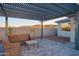 Relaxing patio with a pergola, comfortable outdoor seating, and scenic mountain views, perfect for outdoor enjoyment at 4924 W Capistrano Ave, Laveen, AZ 85339