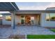 Enjoy this covered patio with desert views, pavers and artificial grass at 4924 W Capistrano Ave, Laveen, AZ 85339
