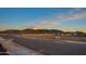 Street view showcases a newly constructed neighborhood with mountain views at 4924 W Capistrano Ave, Laveen, AZ 85339