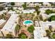 Aerial view of the community, showing the pool, buildings, and landscaping at 4950 N Miller Rd # 122, Scottsdale, AZ 85251