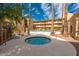 Community hot tub with plenty of space for lounging around the edges at 4950 N Miller Rd # 122, Scottsdale, AZ 85251