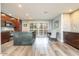 Modern kitchen with stainless steel appliances, wooden cabinets, and a large island with bar seating at 4950 N Miller Rd # 122, Scottsdale, AZ 85251