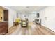 Open living room with hardwood floors, a bright rug, stylish furniture, and plenty of natural light at 4950 N Miller Rd # 122, Scottsdale, AZ 85251