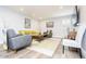 Spacious living area with modern furniture, a patterned rug, recessed lights, and serene wall colors at 4950 N Miller Rd # 122, Scottsdale, AZ 85251