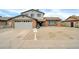 Charming two-story home featuring a well-manicured front yard and a classic brick facade at 5228 W Ironwood Dr, Glendale, AZ 85302
