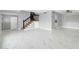Beautiful living area showcasing sleek floors and a classic staircase at 5228 W Ironwood Dr, Glendale, AZ 85302