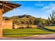 Lush backyard featuring a putting green and views of the desert landscape at 5480 E Desert Creek Ln, Cave Creek, AZ 85331