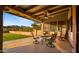 Inviting covered patio featuring comfortable seating and stunning mountain views at 5480 E Desert Creek Ln, Cave Creek, AZ 85331