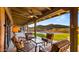 Expansive covered patio overlooking a pool and lush desert landscape at 5480 E Desert Creek Ln, Cave Creek, AZ 85331
