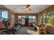 Bright exercise room features brick walls, multiple windows with mountain views, ceiling fan and carpet flooring at 5480 E Desert Creek Ln, Cave Creek, AZ 85331