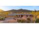 Charming brick home with a two-car garage and desert landscaping at 5480 E Desert Creek Ln, Cave Creek, AZ 85331