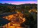 Spacious outdoor patio area featuring desert landscaping with outdoor seating and dining space at 5480 E Desert Creek Ln, Cave Creek, AZ 85331