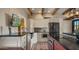 Bright kitchen with white cabinetry, stainless steel appliances and island seating at 5480 E Desert Creek Ln, Cave Creek, AZ 85331