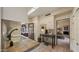 Bright kitchen with white cabinets, tile floors and a view through an open doorway to a sitting area at 5480 E Desert Creek Ln, Cave Creek, AZ 85331