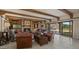Living room with a fireplace, comfortable seating, and a view of the pool at 5480 E Desert Creek Ln, Cave Creek, AZ 85331