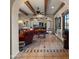 Inviting living room with exposed beam ceiling and seamless flow to the kitchen at 5480 E Desert Creek Ln, Cave Creek, AZ 85331