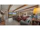 Bright living room with beamed ceilings, comfortable seating, and mountain views at 5480 E Desert Creek Ln, Cave Creek, AZ 85331