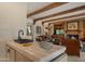 Comfortable living room with tiled counter, fireplace, and cozy seating at 5480 E Desert Creek Ln, Cave Creek, AZ 85331