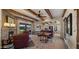 Beautiful living room featuring exposed beam ceiling and a seamless connection to the outdoors at 5480 E Desert Creek Ln, Cave Creek, AZ 85331