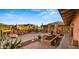 Expansive brick patio featuring outdoor seating, desert views, and lush succulent landscaping for relaxation at 5480 E Desert Creek Ln, Cave Creek, AZ 85331