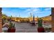 Wide patio view features desert landscape and stylish seating creating perfect ambiance for outdoor living at 5480 E Desert Creek Ln, Cave Creek, AZ 85331