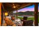 Inviting covered patio with comfortable seating, providing a serene outdoor living space with scenic views at 5480 E Desert Creek Ln, Cave Creek, AZ 85331