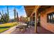 Scenic outdoor living space with a covered patio and putting green at 5480 E Desert Creek Ln, Cave Creek, AZ 85331