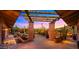 Picturesque patio area featuring brick columns and lush desert landscaping at 5480 E Desert Creek Ln, Cave Creek, AZ 85331