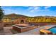 Relaxing pool area featuring a brick fireplace and spa for outdoor enjoyment at 5480 E Desert Creek Ln, Cave Creek, AZ 85331
