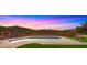 Refreshing swimming pool with mountain views and an outdoor fireplace, perfect for relaxation and entertainment at 5480 E Desert Creek Ln, Cave Creek, AZ 85331