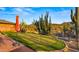 Private putting green surrounded by desert landscaping at 5480 E Desert Creek Ln, Cave Creek, AZ 85331
