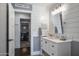 Powder room boasting shiplap walls, modern vanity, and stylish fixtures visible from the doorway at 5501 N 1St St, Phoenix, AZ 85012