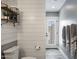 Stylish bathroom features shiplap walls, floating shelves, and a door to the outside at 5501 N 1St St, Phoenix, AZ 85012