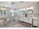 Elegant bathroom features a glass shower, soaking tub, and double vanity with modern fixtures at 5501 N 1St St, Phoenix, AZ 85012