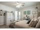 Bright bedroom featuring a vanity desk, a comfortable bed, and ample natural light at 5501 N 1St St, Phoenix, AZ 85012